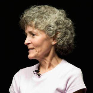 Woman smiling while glancing to the right